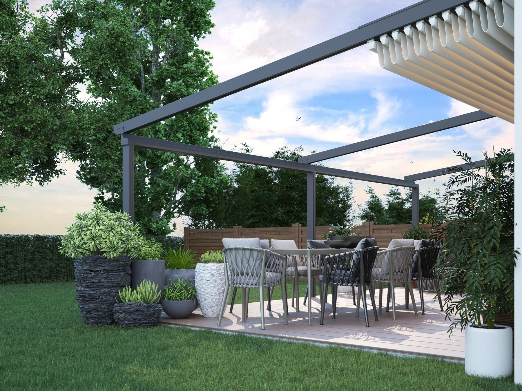 Terrassenüberdachung aus Aluminium mit Glasdach an einem modernen Wohnhaus in Moers